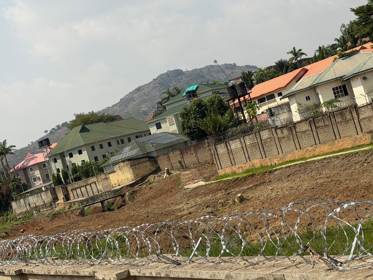 adeyanjudeji's tweet photo. Wike the unrepentant liar that cares only about money says some people built houses on waterways when he is the one allocating green areas to politicians, estate developers & his cronies. This is one of such examples. They allocated waterways to someone behind model secondary school Maitama who sand field and covered the entire drainage.