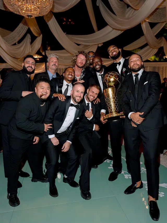 NBA_NewYork's tweet photo. Karl-Anthony Towns, Jalen Brunson, Justin Bieber, Freddie Gibbs, Yung Gravy, KAT’s groomsmen and The Larry O’Brien 🏆 https://t.co/VkiQicj2L5