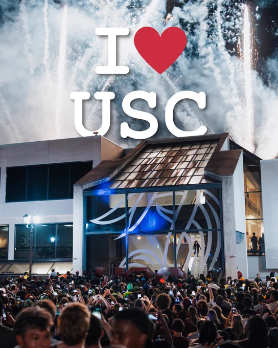 Fireworks on top of the Russell House with "I love USC" text.