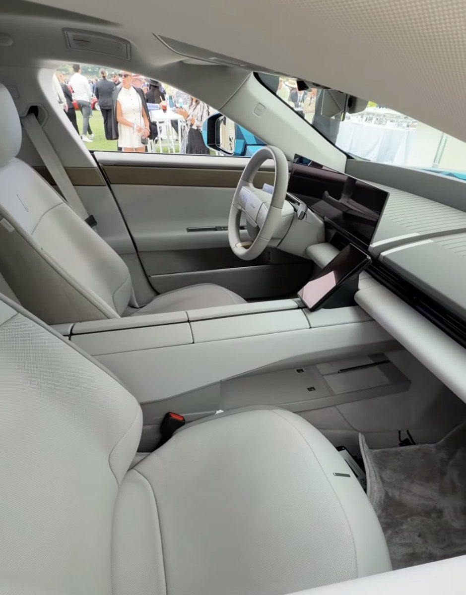 SawyerMerritt's tweet photo. The production interior of Jaguar's upcoming $130,000 EV has a floating center console that extends from the front of the car all the way to the rear. Jaguar calls it a "spine." They will only offer this layout. They say it creates a "first class" experience.

Photos below. Full car unveil next month.