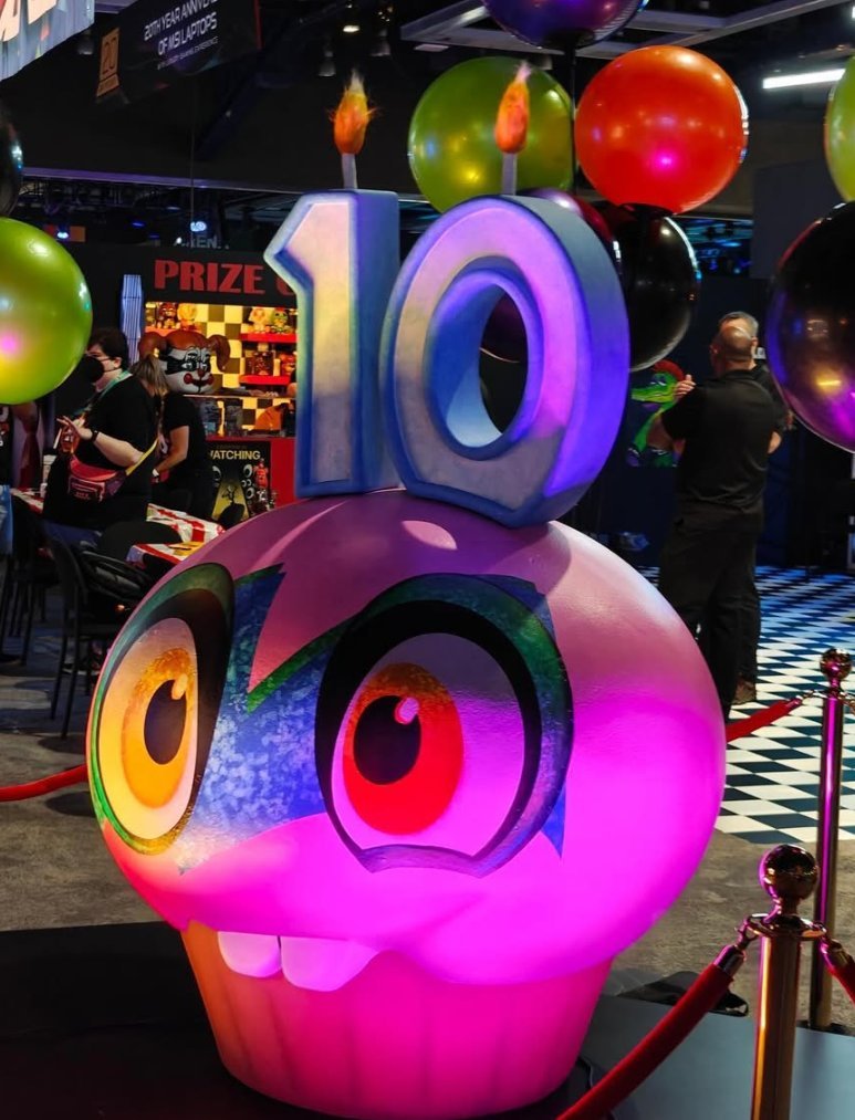 FNaFSpectrum's tweet photo. Today marks 2 YEARS since Steel Wool's last PAX West appearance for FNAF's 10th anniversary in 2024.

The booth featured an exclusive VR demo of Secret of the Mimic, new posters, neon signs, Caution Robot, a Prize Counter, various activities and more. https://t.co/RXBOHRfQgB