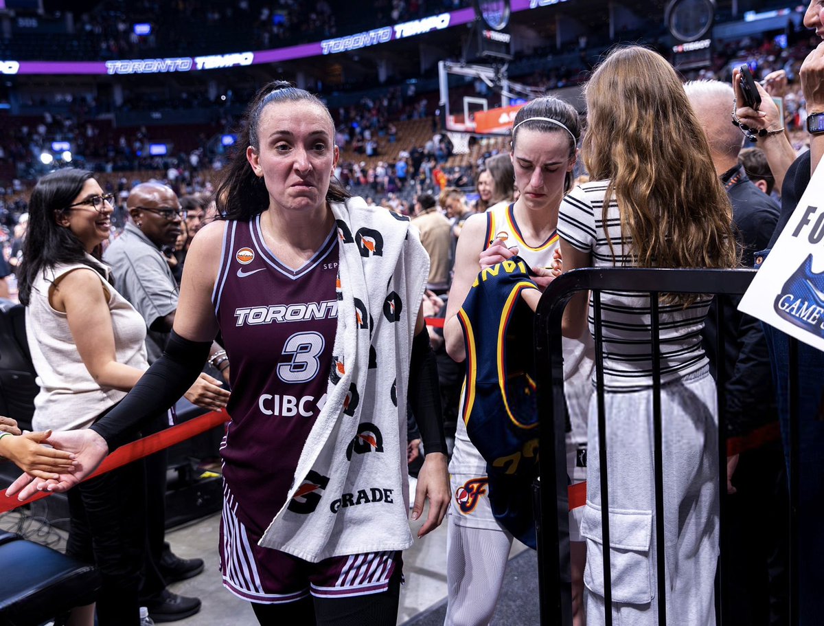 SnapshotKyle's tweet photo. Marina Mabrey looking salty af while Caitlin Clark signs some jerseys 😂💀 https://t.co/vQAwaPBHyP