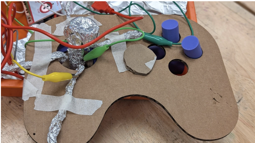 RuralTechFund's tweet photo. Ms. Connolly's students in Johnson, VT, used Makey Makey to turn everyday materials into working game controllers! Using foil, cardboard &amp; play-doh, they built custom joysticks, learned about closed-loop circuits, and mapped physical inputs to Scratch games. https://t.co/fk9WMOqqsv