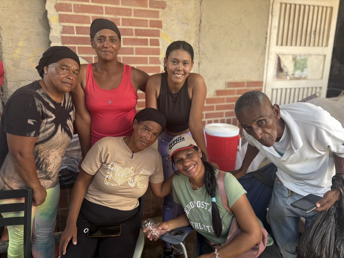 Cat_lucy1's tweet photo. Families of OPPE26 in La guaira, Venezuela, are still searching for family members almost two months after the tragedy and some still sleeping in tents by this disaster site. Many NGOs have left. These people say they need ice, medicine, food and water still. The heat has been unbearable today - but they can’t escape it.