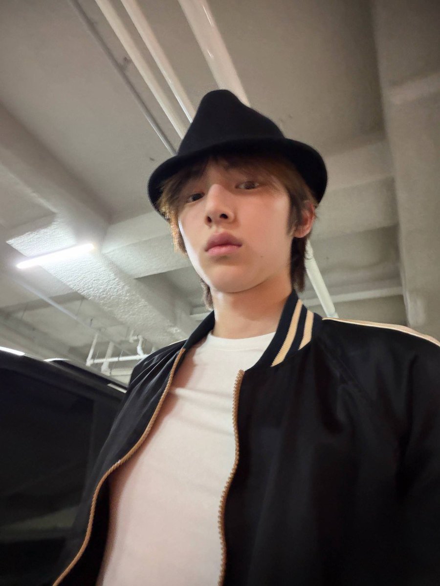 Jruhooun's tweet photo. Threw on this goofy lil hat and somehow it started eating harder than it should. Hair covering half my eyes, bomber sitting clean, and I’m staring into the cam like this random parking lot selfie deserves its own album cover. https://t.co/FF8aQtUjVz