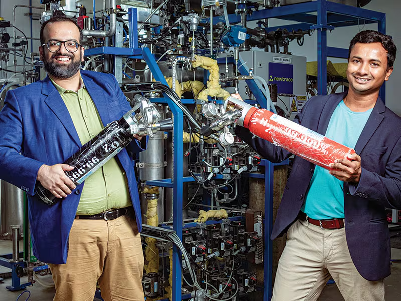 Fintech03's tweet photo. Two scientists, a fluid mechanics PhD and a nanomaterials fellow, building membrane chemistry that only 3 other companies on Earth can do, sitting quietly in a 20MW pilot plant in Bengaluru while the world argues about whether green hydrogen will ever be commercially real.

A few might be thinking what is Green Hydrogen?

Green hydrogen is nothing but hydrogen made by splitting water using renewable electricity instead of fossil gas. It is one of the few credible paths to decarbonizing steel, fertilizer, shipping, and heavy industry. 

But the electrolysers that do this splitting have a dirty secret: the membranes inside them need to be highly selective for ions while staying chemically stable, which makes them expensive to manufacture and most designs lean on rare earth metals and complex materials that keep costs stubbornly high. 

This is the actual reason green hydrogen has stayed a subsidy dependent science project instead of a real industry.

To solve this exact problem Newtrace was born 5 years ago.

2 people, real scientific depth, not repackaged engineers, Prasanta Sarkar holds a PhD in fluid mechanics from Université Grenoble Alpes, and Rochan Sinha is a J.N. Tata fellow with a background in nanomaterials and electrochemistry, both having cut their teeth in renewable energy systems in Europe before coming back to build this in India. 

They rebuilt the electrode and membrane chemistry from scratch. The manufacturing costs cut by ~30%, with the rare earth metals eliminated entirely from the process.

Newtrace has a near-commercial prototype running and operates a 20MW pilot facility, and is building toward 1MW electrolyser systems today, scaling to 10MW by 2027. 

They have raised $1M pre seed in 2022 led by Speciale Invest and Micelio Fund, then $5.6M seed in 2023 and most recently $6.3M raised specifically to commercialize their electrolyser electrode technology and push down green hydrogen production costs further. 

Peak XV Partners and Aavishkaar Capital are in the cap table, serious climate tech literate money, not just government grant chasers.

Why this matters for Bharat......

- Steel, fertilizer, and shipping are exactly the industries where Bharat cannot simply "go electric",  they need actual clean hydrogen as an input, not just clean power. 

- Every electrolyser India imports today is a strategic dependency, the same story as solar cells and semiconductors before this.

If Newtrace's cost down chemistry scales, Bharat will build exportable IP in the one segment (electrode/membrane tech) that is genuinely defensible and globally scarce, at a moment when the government's own National Green Hydrogen Mission and rare earth corridor push are explicitly trying to create exactly this kind of domestic deeptech champion. 🙏🙏