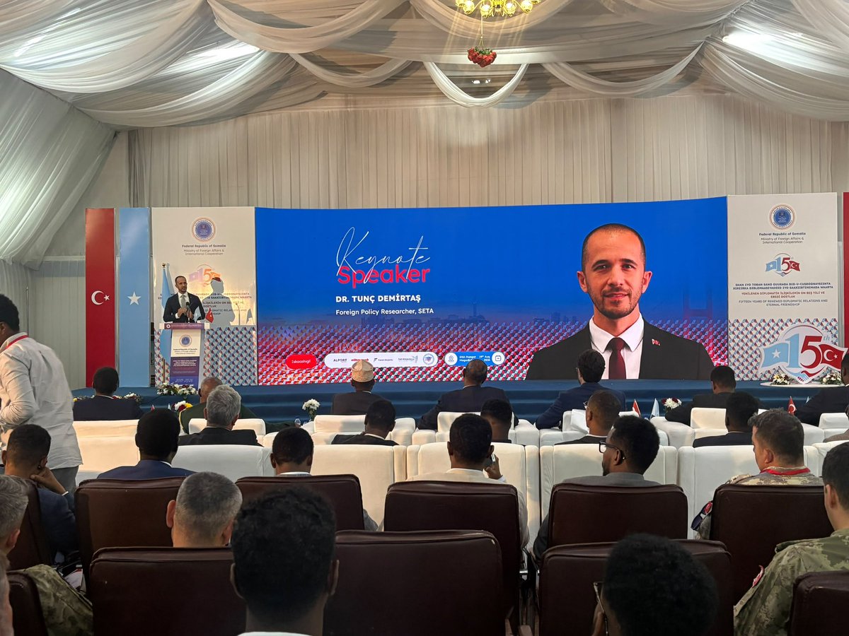 tuncdemirtas's tweet photo. Cumhurbaşkanımız Sayın @RTErdogan’ın Somali’ye gerçekleştirdiği tarihi ziyaretin 15. yıl dönümünde, Somali federal Cumhuriyeti dışişleri ve uluslararası iş birliği bakanlığı tarafından Somali federal halk Meclisi Başkanlığı himayelerinde gerçekleştirilen anma etkinliğine katılmak için Mogadişu’daydık.

On beş yıl, bir kalkınma programının süresi değildir. Bir insanın neredeyse ilk çeyreğidir. 2011’de, kıtlığın en ağır günlerinde doğan Somalili çocuk bugün on beş yaşında. 

O çocuğun hatırladığı şey açlıktan ziyade büyürken gittiği okul, tedavi görülen hastane, işleyen bir havalimanı ve liman ve tabii ki geçen Nisan’da umutlarla Mogadişu’dan yolculanan Çağrı Bey.

Kısacası 15 sene önce 2011’de bu şehre bir uçak indi.

2026’da da bu şehrin yaklaşık 400 kilometre açığına bir sondaj gemisi demirledi.

Somali eski Somali değil.

Aradaki fark on beş yıl değil. 2011’de Somali için bir şey yapılıyordu. 2026’da Somali ile birlikte yapılıyor.

Türkiye-Somali ortaklığının pekişerek gelişmesi için bölgeye istikrarsızlık getirecek hareketleri görerek ama pozitife odaklanarak çalışmaya devam edeceğiz.

——

On the 15th anniversary of President @RTErdogan’s historic visit to Somalia, we were in Mogadishu for the commemorative event held by the Ministry of Foreign Affairs and International Cooperation of the Federal Republic of Somalia, under the patronage of the Speaker of the House of the People.

Fifteen years is not the length of a development programme. It is almost the first quarter of a human life. A Somali child born in 2011, in the worst days of the famine, is fifteen years old today. And what that child remembers is not hunger - it is the school he grew up going to, the hospital where he was treated, a working airport and a working port, and of course the Cağrı Bey, which set out from Mogadishu this April carrying so much hope.

In short; fifteen years ago, in 2011, a plane landed in this city.

In 2026, a drillship dropped anchor some 400 kilometres off its coast.

Somalia is not the Somalia it once was.

And the difference between the two is not fifteen years.

In 2011, something was being done FOR Somalia.

In 2026, it is being done WITH Somalia.

For the Türkiye-Somalia partnership to keep deepening, we will carry on working -clear-eyed about the moves that would bring instability to this region, but with our focus firmly on what is positive.