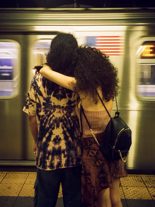 Image of people hugging on a platform