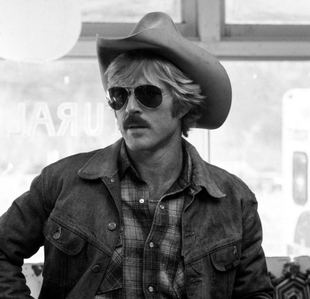 rachcorrine's tweet photo. SO YOU WANT TO DRESS LIKE ROBERT REDFORD (someone asked me for this can’t find the tweet). Seven simple steps. 

First. Look like Robert Redford. 

Second. Start with great denim (obvs). Medium to dark wash. Straight leg is best (f*ck you guys we don’t need to get toooo baggy all the time relax). Mid to high rise. No distressing. Clean classic hot. 

Third. Good shirts go a long way. Oxfords. (White, blue.) Denim shirts. Plaid. Think western vibes. But not full cowboy costume. An occasional stripe. Roll the sleeves. (The universal feral women call.) 

Fourth. Nail the knits. Think knit crewnecks. Knit Johnny collars. Cable knits. Chunky cardigans. Simple wool. Heather grey, oatmeal, camel, navy, chocolate, forest green.

Fifth. Rugged jackets > technical or stuff outerwear. Think suede. Chore coats. Field jackets. Waxed cotton. Corduroy. Worn in leather. Should look like you’ve had for years even if you buy it today. 

Sixth. If you’re not doing denim. Do a trouser that’s got some pleats. Higher rise good. Straight leg cords, chinos. Or flannel wool also good options.

And finally. Substantial footwear. Boots obvs. Brown suede, leather work boots. A loafer and a simple sneaker also in the rotation. 

Optional eighth thing (while we’re here). Accessories make the look. A go to belt. Nice sunglasses. Done and done.