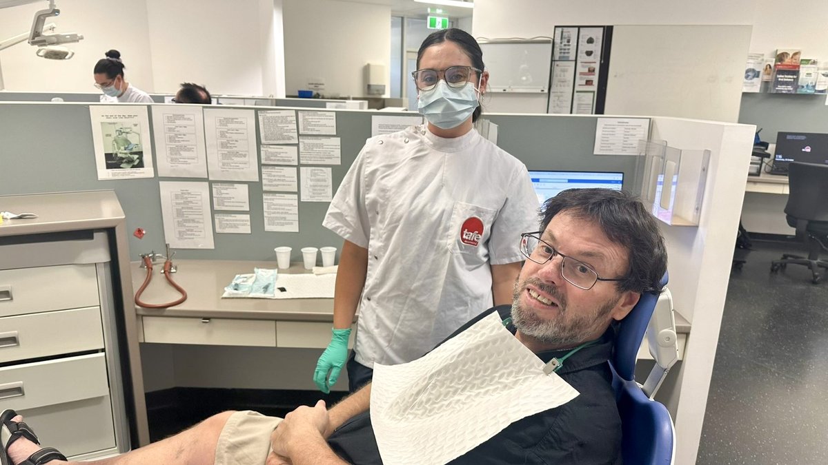 TAFEQld's tweet photo. This #NationalScienceWeek, we’re celebrating science that restores confidence 🦷
At TAFE Queensland’s South Bank Denture Clinic, students deliver real care while building real skills – helping patients like Shaun smile again.
Read his story: https://t.co/4LO9KSr5pS https://t.co/DlsDmZHGiz