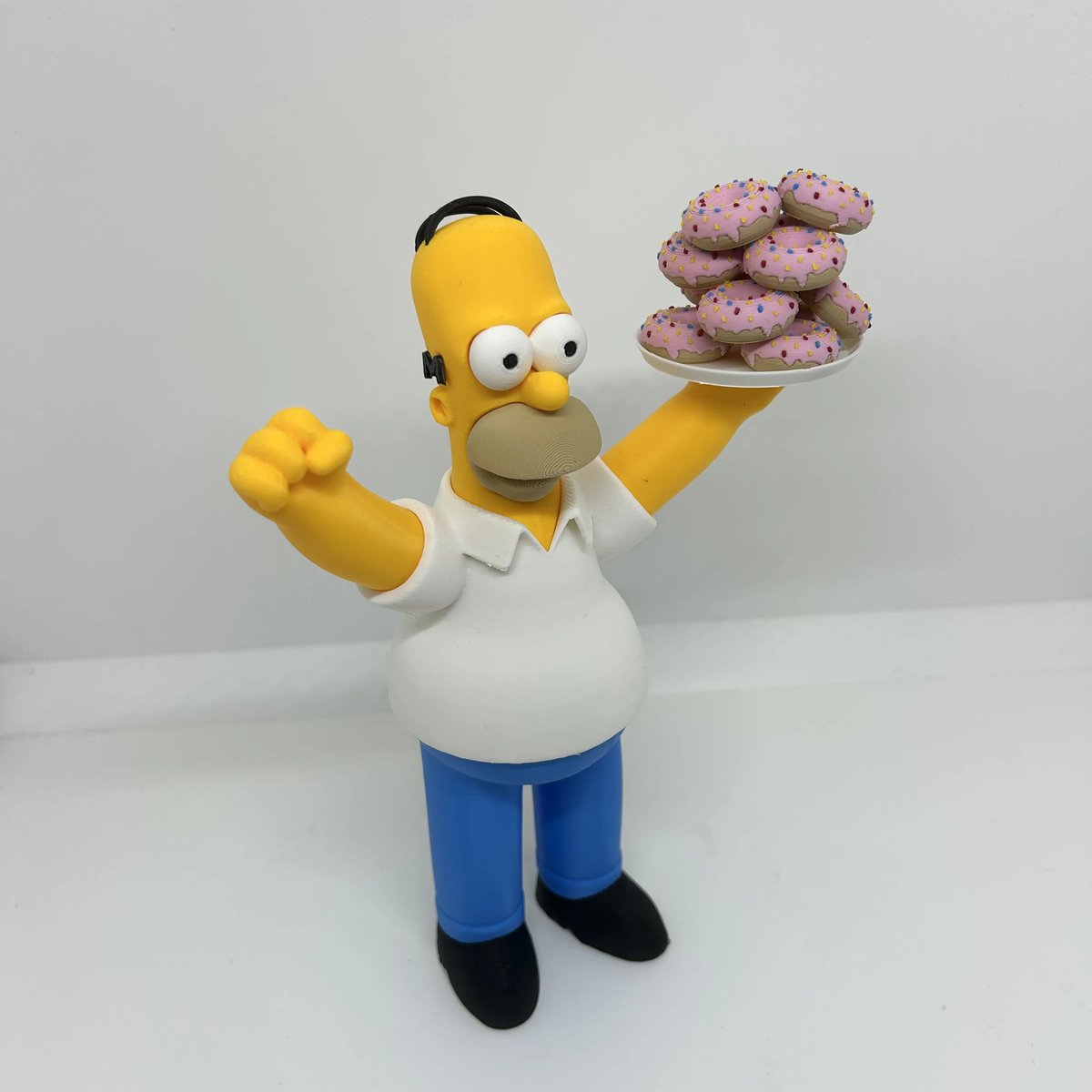 yonigudiel's tweet photo. Mmm... donuts... There may be nothing in the world he loves more! Legendary Homer Simpson in his element, ready for a sweet feast. This 3D print radiates pure joy and sugar! More unique figurines available on our profile! https://t.co/Rj2uK466UN