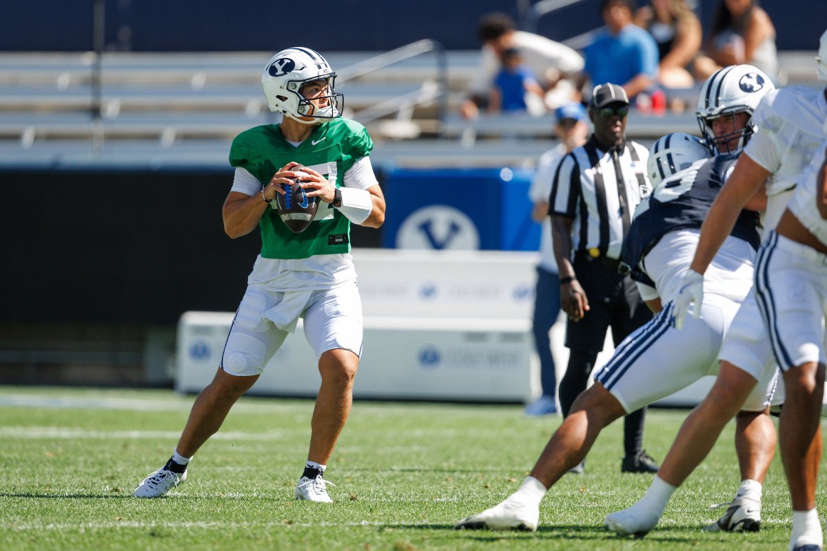 CougSportsMedia's tweet photo. Former BYU & NFL LB Brady Poppinga joined @espnthefan to break down the MVPs from the Saturday scrimmage:

What are you hearing about the scrimmage? Who stood out? Who are the MVPs of the LaVell Edwards scrimmage?

Brady: Bear [Bachmeier]—was phenomenal. He had a magnificent scrimmage. He didn't really run it because you can't tackle him, but it's stuff that I've seen before. If they would do those quarterback draws, it's so funny because you get these defenders who come in from the side thinking they've got him, and in the scrimmage they're just tagging off. But you cannot tackle him from the side; you've got to square your hips up. That was just the icing on the cake. He had some throws—like he had a throw where he's on the left hash, throws it all the way across the field over outstretched arms, into a tight window into the hands of Legend Glasker. I mean, a sweet out route. That's indefensible.

I thought our offensive line was really good. They moved us, they hooked us, and the defensive guys were getting moved. I think our defense kind of took one to the chops. This happens during training camp; it kind of goes back and forth. Overall, from the first practice until the scrimmage, if you evaluated each day on who won, I would say the defense probably won more of those first practice days than the offense. But for sure, the offense was in control in that scrimmage. I find that to be very encouraging personally because that's how you want it to be. If one unit is continually overpowering the other, you kind of question, "Man, are we gonna be okay?"

The plays that the offense did make in the passing game were earned plays. When they tackled in the scrimmage, it was only for a drive or two. The offense had to be really good—precisely thrown balls, precisely run routes, good blocking. They weren't flukes or gimmes. At the same time, the defense literally has to be able to get the guy on the ground, and that's a good thing because it shows how good our offense is. Even with LJ [Martin], he didn't play during the tackling phase, so when he's in there getting tagged up, you just don't know if that corner is gonna be able to take him down. We've seen him enough to know what will happen—which is most likely they won't, or it will take two or three guys, and he'll power through for another 5-10 yards. So it was a good back-and-forth. It's been that way through camp, and we have a good team. We'll just have to see how we compare to everybody else.

Full details: https://t.co/9LlqzA4ofg

📸: @BYUFOOTBALL @BYUphoto