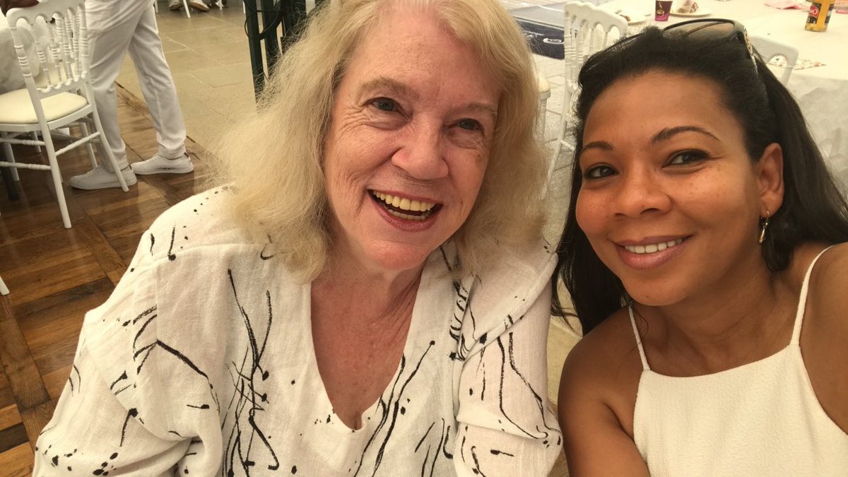 africatechie's tweet photo. My mother Nancy Hartwell turns 80 today!! What a blessing it is to be able to celebrate her and still have her in my life.

My father's history is extraordinary and well documented. My mom’s life is extraordinary too, and too few know it. I want to take a moment to honor her, and her remarkable story.

She was born Nancy Jean Hartwell, in West Virginia, and grew up in Tampa, Florida, where she lives again today. At 17 she moved to Washington, DC to study International Relations at American University, and there she met my father, who was completing a Doctorate in International Comparative Law at Georgetown University.

They wanted to marry in Maryland, but for this blond, blue eyed American and this dark handsome Cameroonian, interracial marriage was, and had been, illegal there for over 300 years. Maryland finally repealed the ban and then the US Supreme Court struck down the remaining state bans in Loving v. Virginia. My parents immediately married.

The newly married couple moved to Cameroon and I was born shortly thereafter. Nancy, or Bessem as she soon became known, quickly integrated into her new country and made it her own. She set out to learn local languages, including my father's language, Kenyang. She became fluent in Bassa and Ewondo, since for those she could support her learning with books and tapes. She still speaks them today. She also had to learn French, and since that wasn't enough, she has added many others since, including Arabic, and taught herself to read Egyptian hieroglyphs.

My mom is a world published author. Her best known works are her plays, written under her pen name Jeanne Ngo Libondo, translated into multiple languages and broadcast on the BBC and ORTF in the 1970s: "Joseph, Haven't You Got Your Bicycle Yet?" and "Oh, How Dearly I Detest Thee!" Both are still being staged in theaters across Africa, half a century after she wrote them. She still writes, and has published novels on the theme of human trafficking, such as "Prince Ibrahim's Favorite" and "Harem Slave."

In Cameroon she became one of the first women to hold an executive position, as directeur administratif at Socamac. She had also worked at Guinness and Crevettes du Cameroun. 
Then there were her cakes and her cookies! Some here will remember. She might have made your birthday cake. One memorable one was for Ahidjo's daughter's wedding in Garoua, for thousands of people. And then there were those peanut butter cookies of hers, sold at Monoprix in Douala.

When other girls my age were given dolls, my mother gave me books. Not just one at a time. She would literally bring me boxes full of books, in English and in French. She loves to travel and I was lucky enough that she would carry me with her, so that by the time I was twelve I had been to more than fifteen countries.

And her house was never only ours. Someone was always staying, for a week or a term or a decade, and several of those people are simply my family now. 

And there is this thing about my Mom. She's like Wikipedia. She will tell you the most random details about history, geography, linguistics. Always learning.

She has never accepted an answer she did not believe. When her friends the Mpondo family were murdered, my mother and I had been amongst the last to have seen them alive. When the official account did not make sense, she did her own investigation, and under Cameroon's Ahidjo regime, it almost cost her her life. It did cost her the country she loved and had made her own. She was forced to move back to the US and start a new life. She then worked for companies like Chemonics before starting her catering business. She is now retired in Tampa, Florida. 

There is so much to say about her, it could fill a book. But on this very special day, I wanted to share with you a bit about her story because it deserves to be written, deserves to be shared. 

Happy 80th birthday, Mom!

Nancy Jean Hartwell. Nancy Hartwell Enonchong. Bessem Enonchong. Jeanne Ngo Libondo.