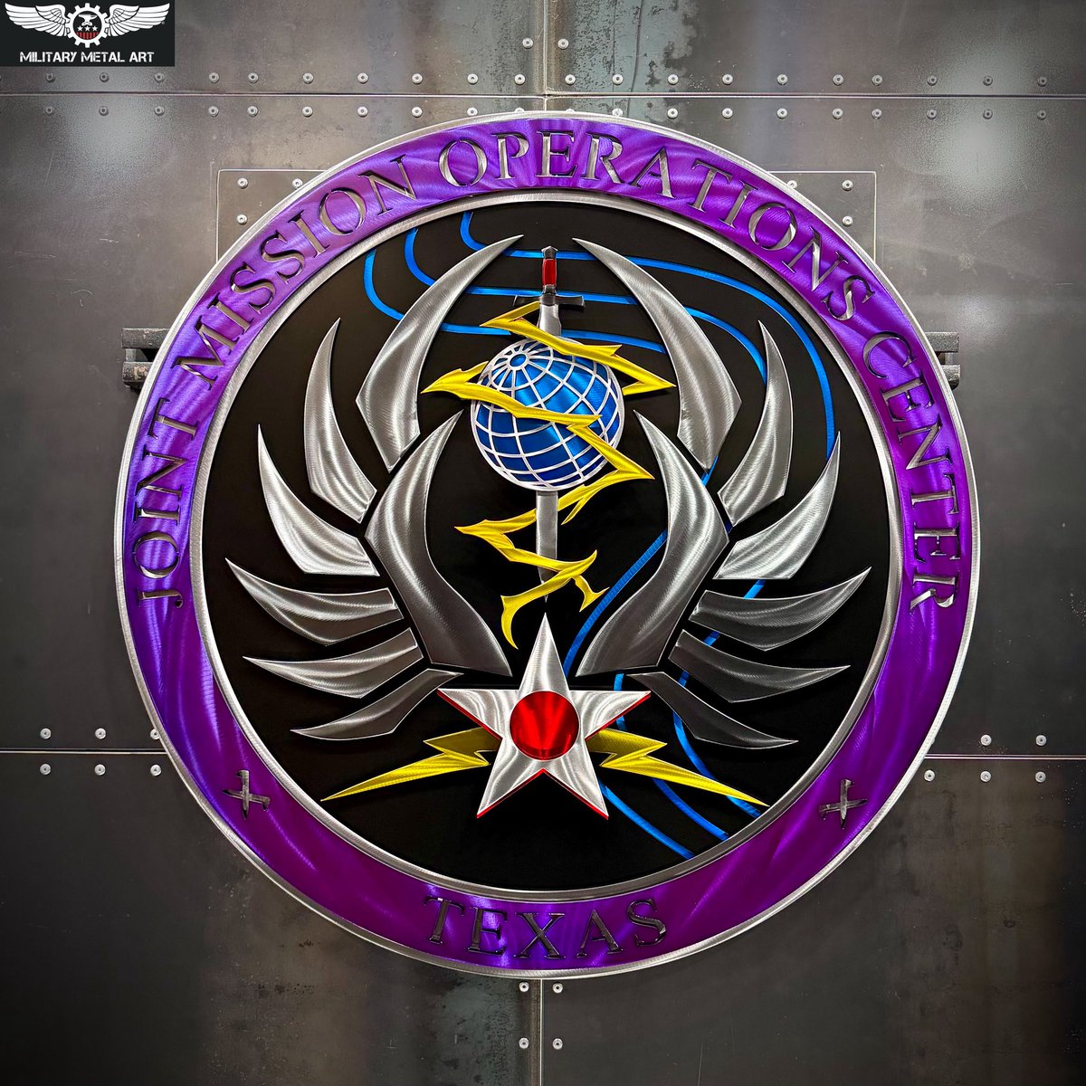 MilitaryMetal's tweet photo. The Joint Mission Operations Center ��� Texas (JMOC-T) helps provide the resilient infrastructure and operational environment required for some of the nation’s most demanding cyberspace missions.

Located at Joint Base San Antonio-Lackland, JMOC-T supports U.S. Cyber Command operations by bringing together the networks, systems, mission platforms, and technical expertise needed to sustain continuous cyber operations.

As part of a broader network of Joint Mission Operations Centers, JMOC-T contributes to an enterprise designed for interoperability, secure coordination, and uninterrupted access to the capabilities cyber forces depend upon around the world.

Much of what happens inside the JMOC appropriately remains outside public view, but its purpose is clear: provide a reliable, resilient foundation that allows cyber operators to remain connected, coordinated, and ready to execute the mission whenever called.

Military Metal Art is honored to bring the identity of the Joint Mission Operations Center – Texas to life.

Honoring Sacrifices. Forging Patriotism.