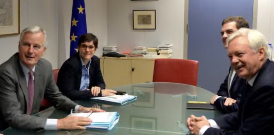 MrJohnNicolson's tweet photo. David Davis will forever be remembered for this image:  grinning gormlessly &amp; note free at the Brexit negotiating table whilst opposite him sat the rapier sharp Michel Barnier for the EU ready to puncture the Brexiters’ hot air. https://t.co/9yAcAHTEiv