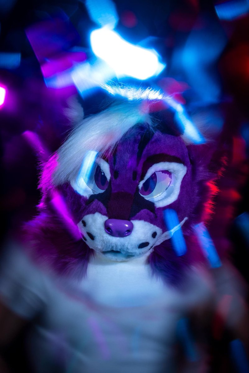 LilytheOcelot's tweet photo. Pretty in purple, dangerous in neon ⚡️

📸 @dire_walf 

#furry #megaplex2026 #fursuit #fursona #neonnights https://t.co/GTphXv1krH
