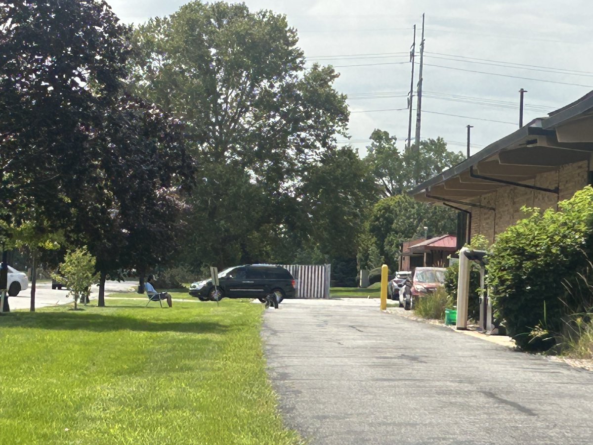 nwi_jsp's tweet photo. Day 10 into the power outage in Northwest Indiana, someone is working in a lawn chair outside a library, using its WiFi. https://t.co/Ass8xcJ4nW