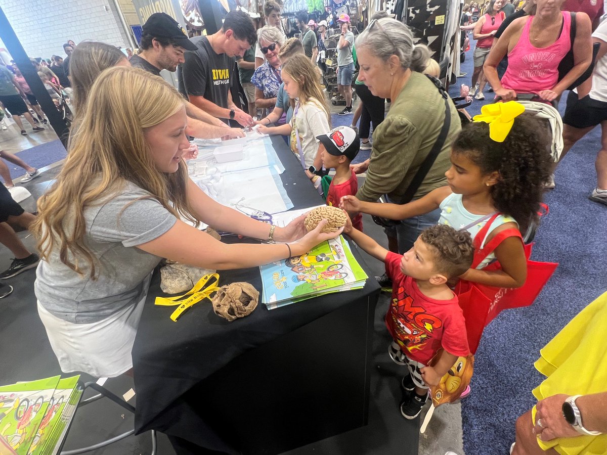 IowaMed's tweet photo. Our medical students are sparking curiosity at the @IowaStateFair! 🧠💥 https://t.co/Kx38ToV7VM