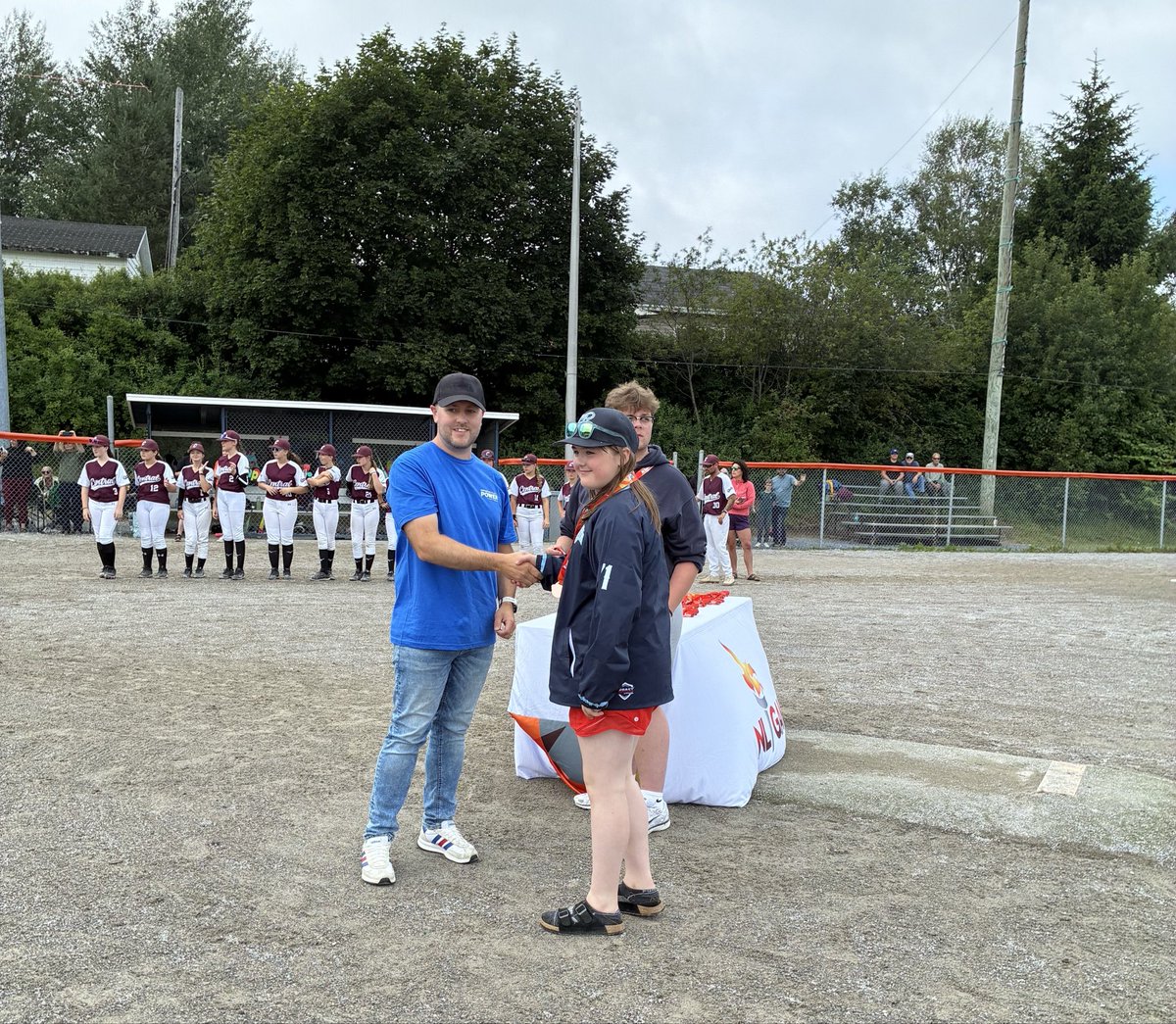 NFPower's tweet photo. Fresh air, friendly competition, and fun! What better way to sum up the 2026 NL Summer Games in Corner Brook. Our employees had fun volunteering, cheering on the athletes and helping make this year another home run. We were honoured to present the medals at the Girls Baseball finals. Congratulations to Western, Central, and Mount Pearl South on your medals and all the athletes who made their communities proud. Hats off as well to @nlgames on your 50th anniversary – we know you’ll continue to knock it out of the park every year!