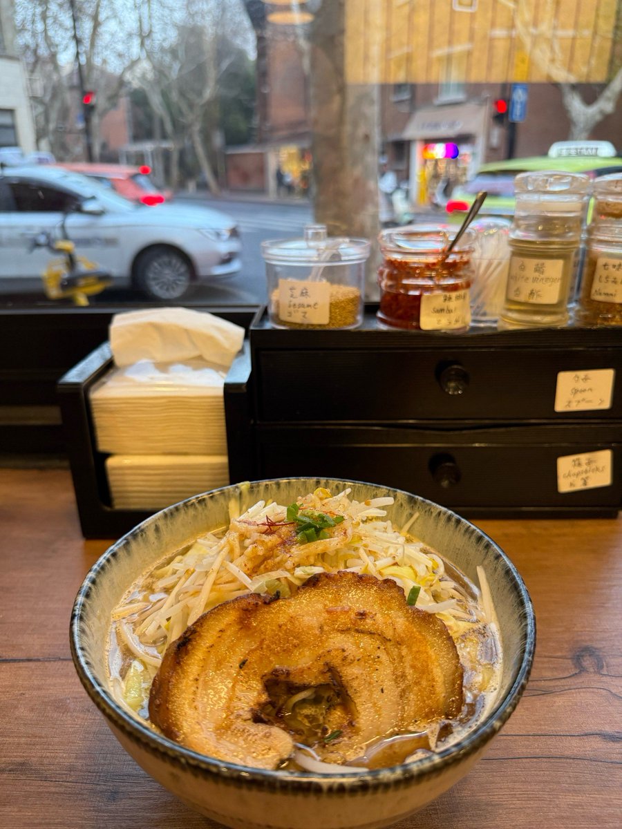 blacksymbol_'s tweet photo. Late night bite: steaming hot ramen with soft-boiled egg, the only warm light in the quiet street. https://t.co/cDjo0NXafu