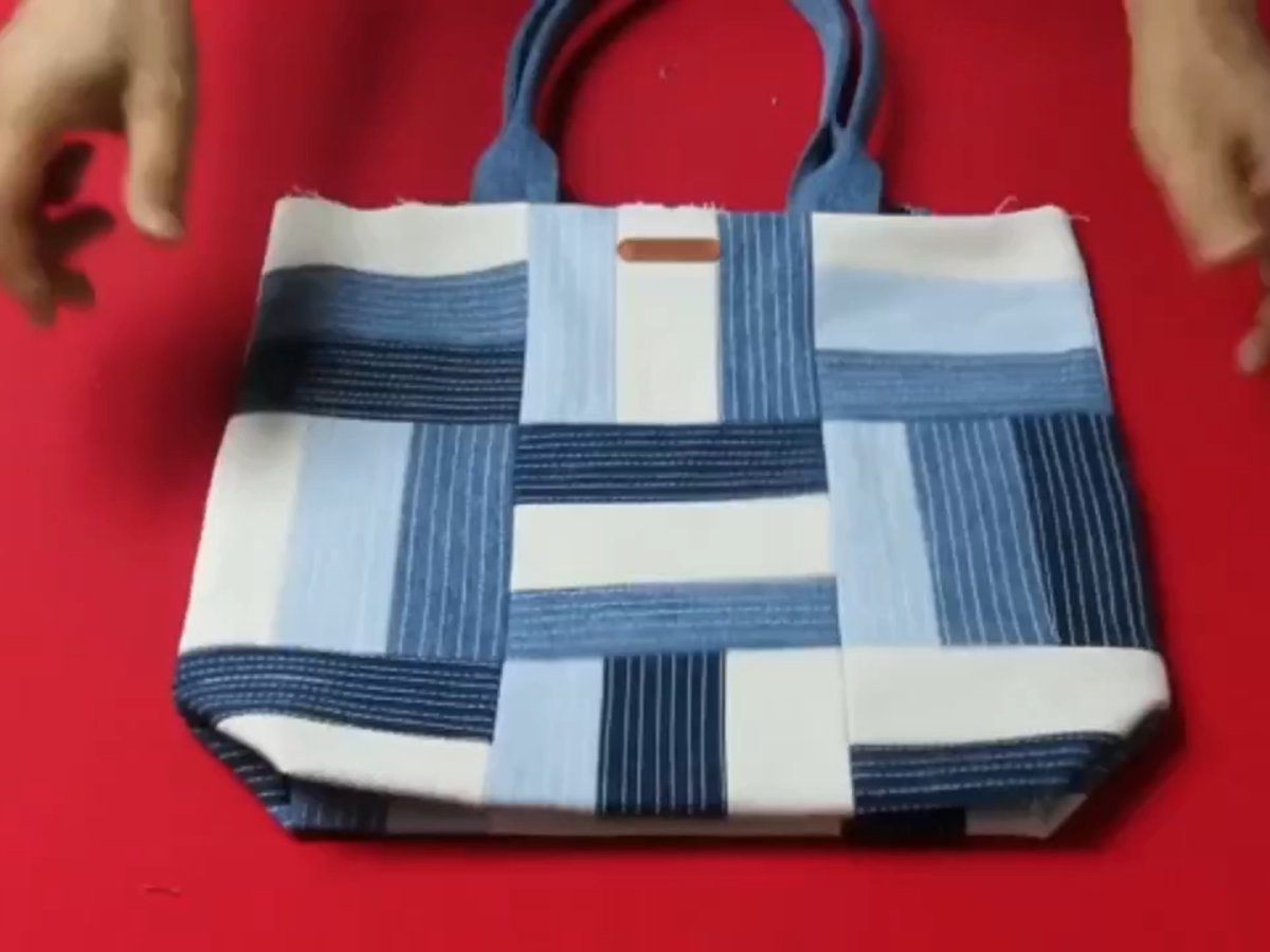 mgajendran71's tweet photo. [My first upcycled denim tote! Cut old jeans → patch frayed edges → add cute pom-poms. Zero waste + 100% fun.  #DIYCrafts #Upcycle] https://t.co/tlphaQuSPZ