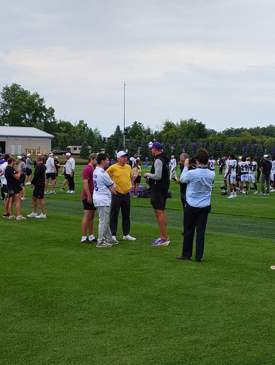 VikingsGazette's tweet photo. Pair of Minnesota football coaches talking at #Vikings camp. Gov. Tim Walz and HC Kevin O'Connell. https://t.co/tihGlrTZYb