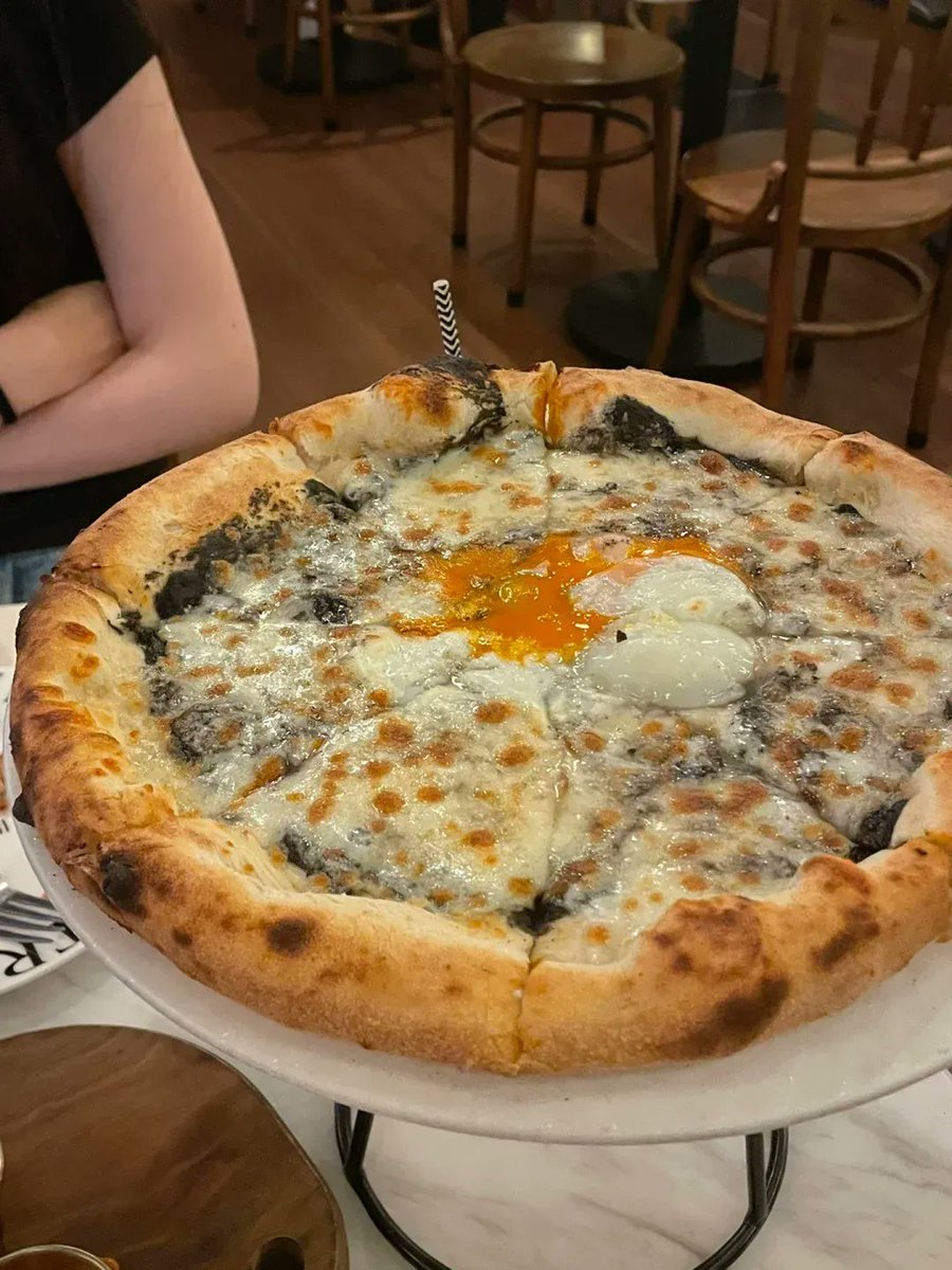 ChkaS73152's tweet photo. Just had the BEST truffle mushroom pizza in town at that cozy hole-in-the-wall on 5th St! Crispy crust, oozing cheese, and aromatic truffle oil = food coma in the best way https://t.co/qT1bEvgjA0