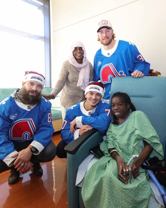 Brent Burns, Sam Malinski and Mackenzie Blackwood this past season during their children’s hospital visit wearing Nordiques jerseys and Avalanche holiday hats