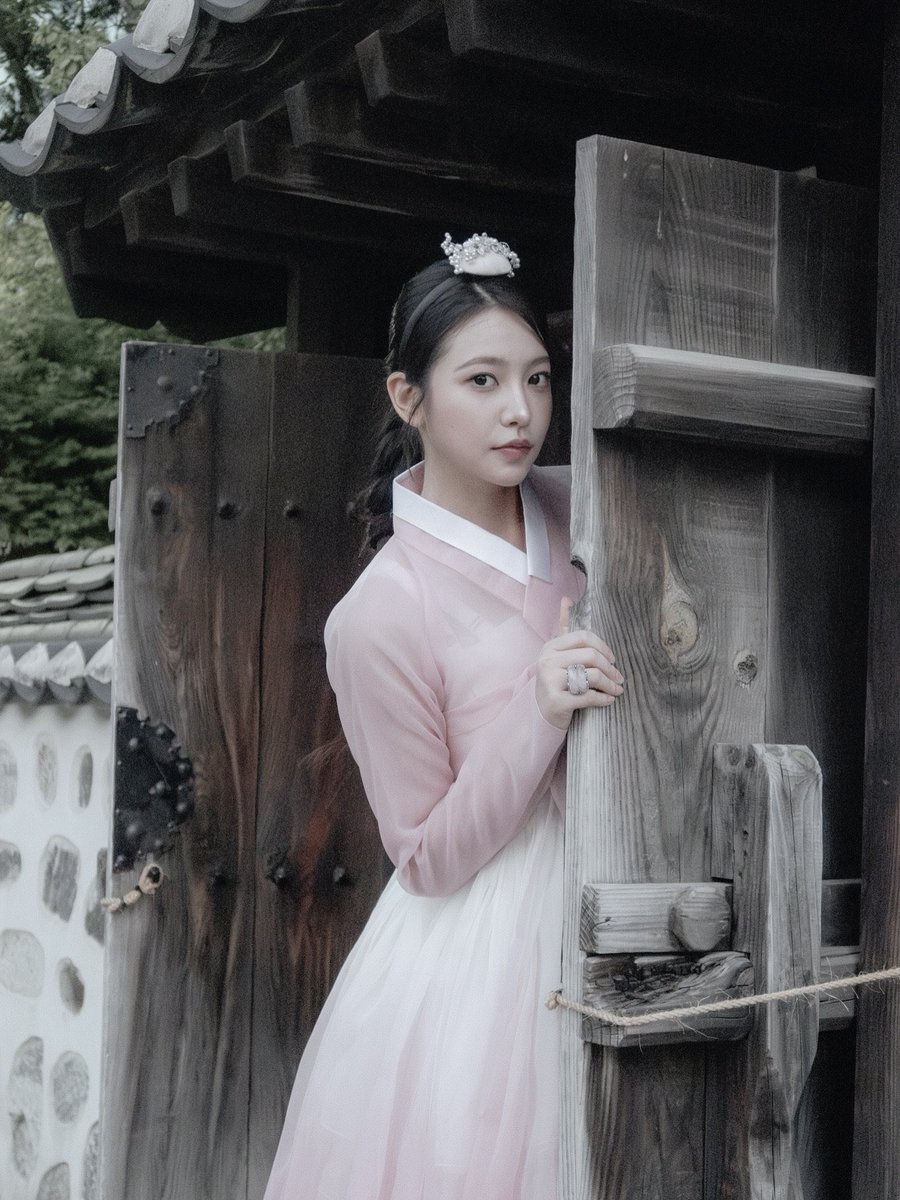 yerimiesu's tweet photo. Framing quiet memories between wooden doors and open skies. There is something so enchanting about blending modern moments with ancient traditions, letting the soft evening breeze carry a sweet sense of calm 𝜗𝜚 ࣪˖ ִ 🦪 ˚｡ https://t.co/KZjfH35esa