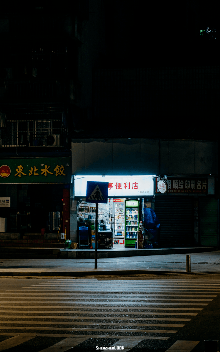 MoonliteFeltham's tweet photo. Random street corner vibe: warm evening glow on a old convenience store sign, a bike leaning against the brick wall—small moments hit different.， https://t.co/2HZulYFymH
