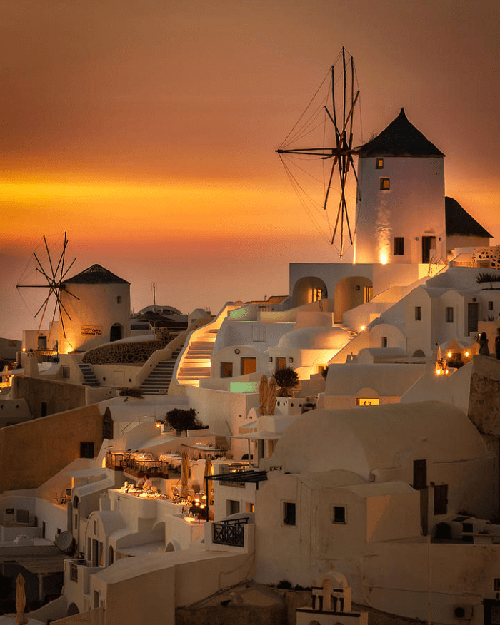 HadeerAyad's tweet photo. Just watched the sunset paint Santorini’s white domes pink and gold—this is the kind of magic that sticks with you forever. No crowds, just the breeze and that perfect view.  #TravelBliss https://t.co/VtoUtu7Qmy