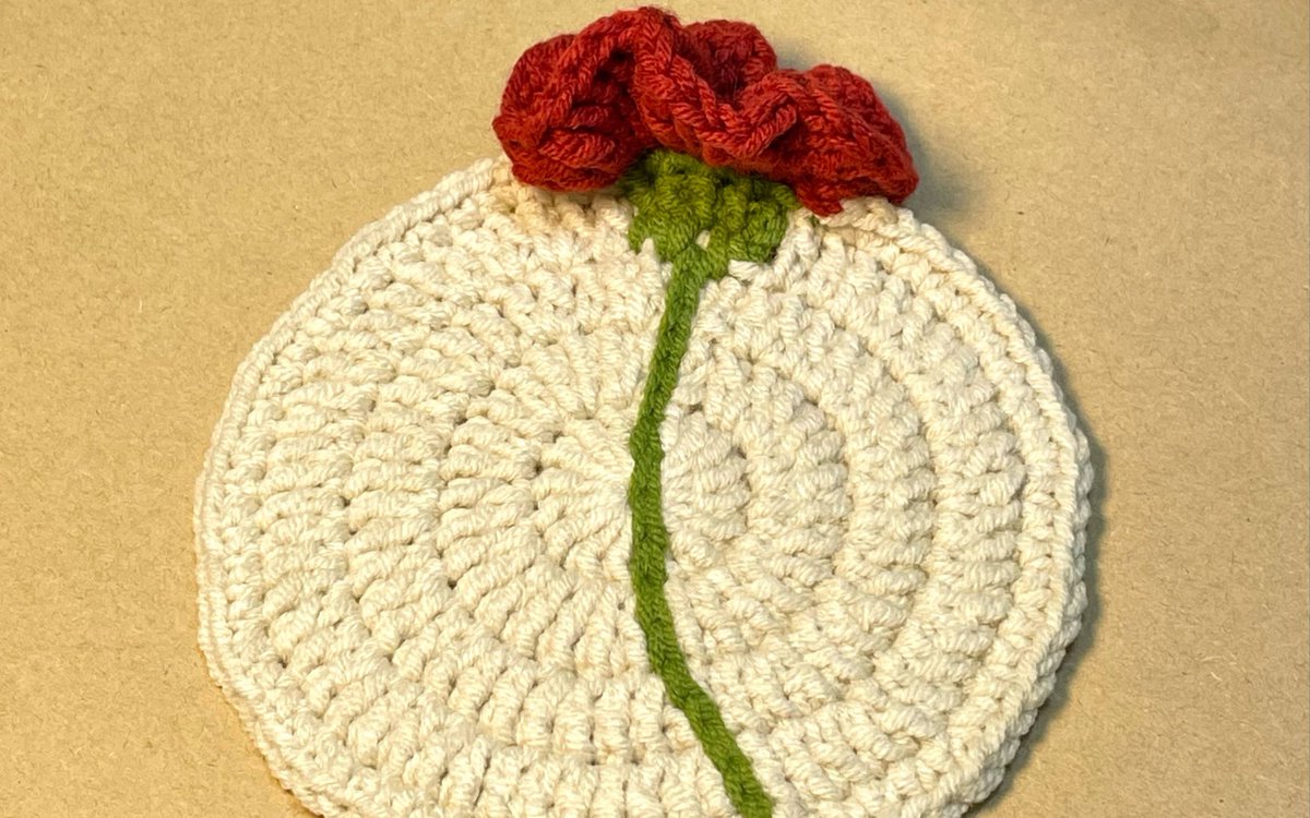 Ninates's tweet photo. Just finished knitting this cozy flower-shaped mug rug for my morning tea break  Handmade with love, small joys hit different! https://t.co/BtDFXGx6GZ