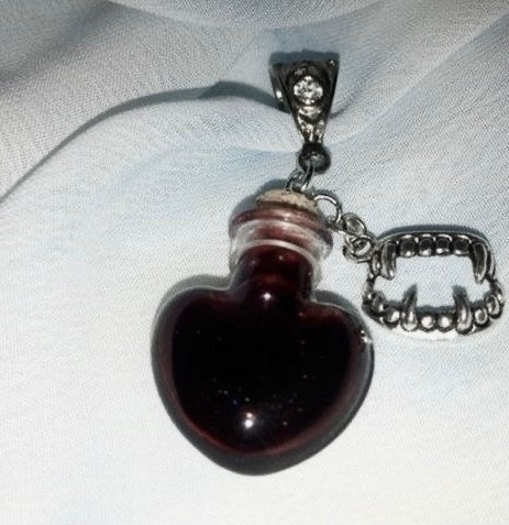 urgoregff's tweet photo. matching blood vial necklaces > anything else https://t.co/LWHmB1M5ux