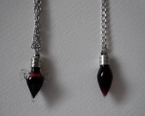 urgoregff's tweet photo. matching blood vial necklaces > anything else https://t.co/LWHmB1M5ux
