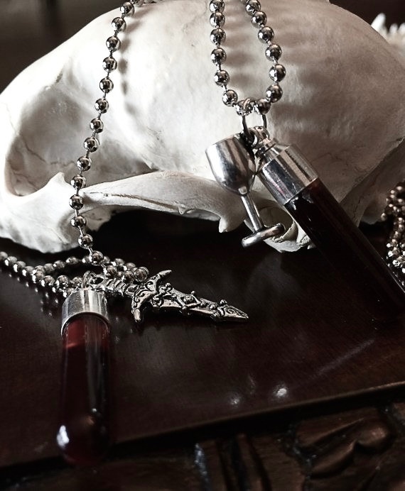 urgoregff's tweet photo. matching blood vial necklaces > anything else https://t.co/LWHmB1M5ux