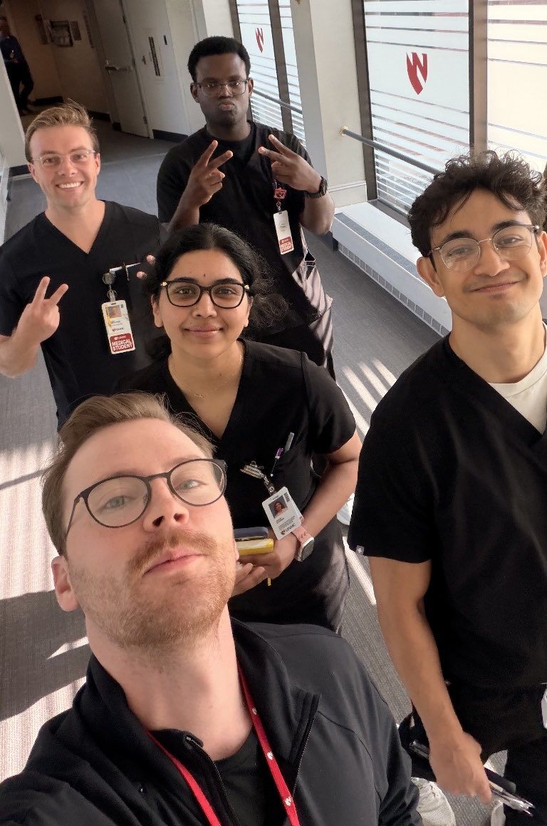 NeurologyUNMC's tweet photo. Our residents work closely with medical students, sharing their knowledge and giving them hands-on clinical learning opportunities. Here’s Dr. Olson (PGY-2) leading a group of medical students to see a consult and learn neurology in action! 

Team Black Scrubs! https://t.co/rKC8qze9mi