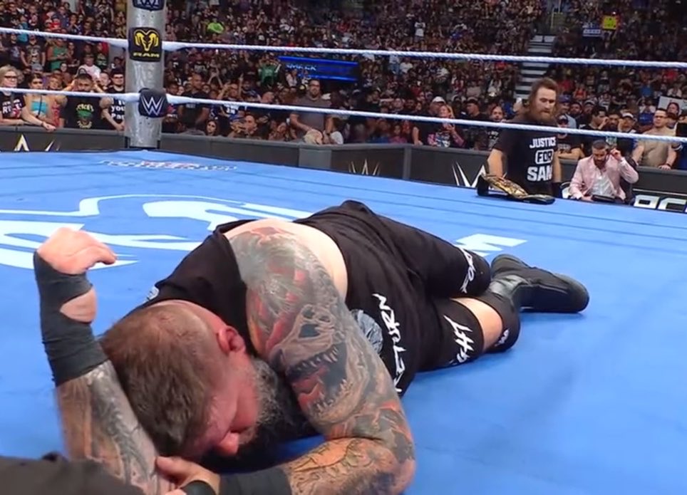 WrestleOps's tweet photo. Sami Zayn was helping Kevin Owens against CM Punk.

Zayn then gave Owens the Title to use against Punk to win the match as the referee was down.

Owens refused to cheat, and Zayn costs him the match.

#SmackDown https://t.co/XBUtqZADRi