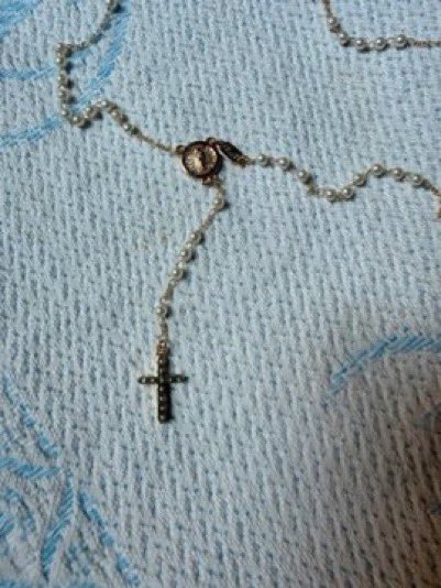 EthanLevins2's tweet photo. A cross and Virgin Mary photo was found on the body of Hezbollah commander Ali Al-Hajj Hassan. 

These were given to him in 2014 by Syrian nuns, when Hezbollah defended a Christian village against Al-Nusra terrorists. 

He was killed in an Israeli strike this week during the “ceasefire”