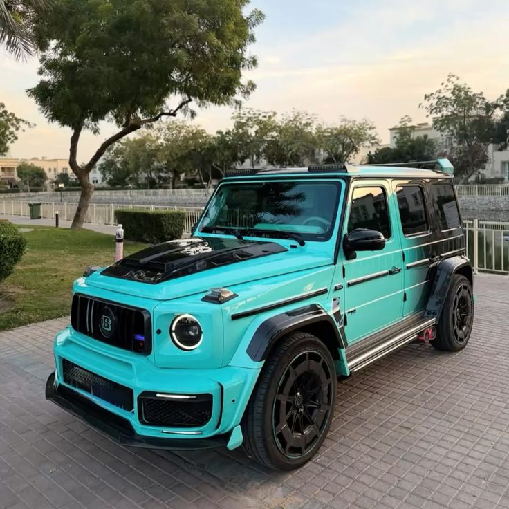 kay_queer's tweet photo. Custom turquoise Brabus G-Wagon parked by the water, featuring a striking fade-to-black paint job. 🩵 https://t.co/y0opRQ0wGv