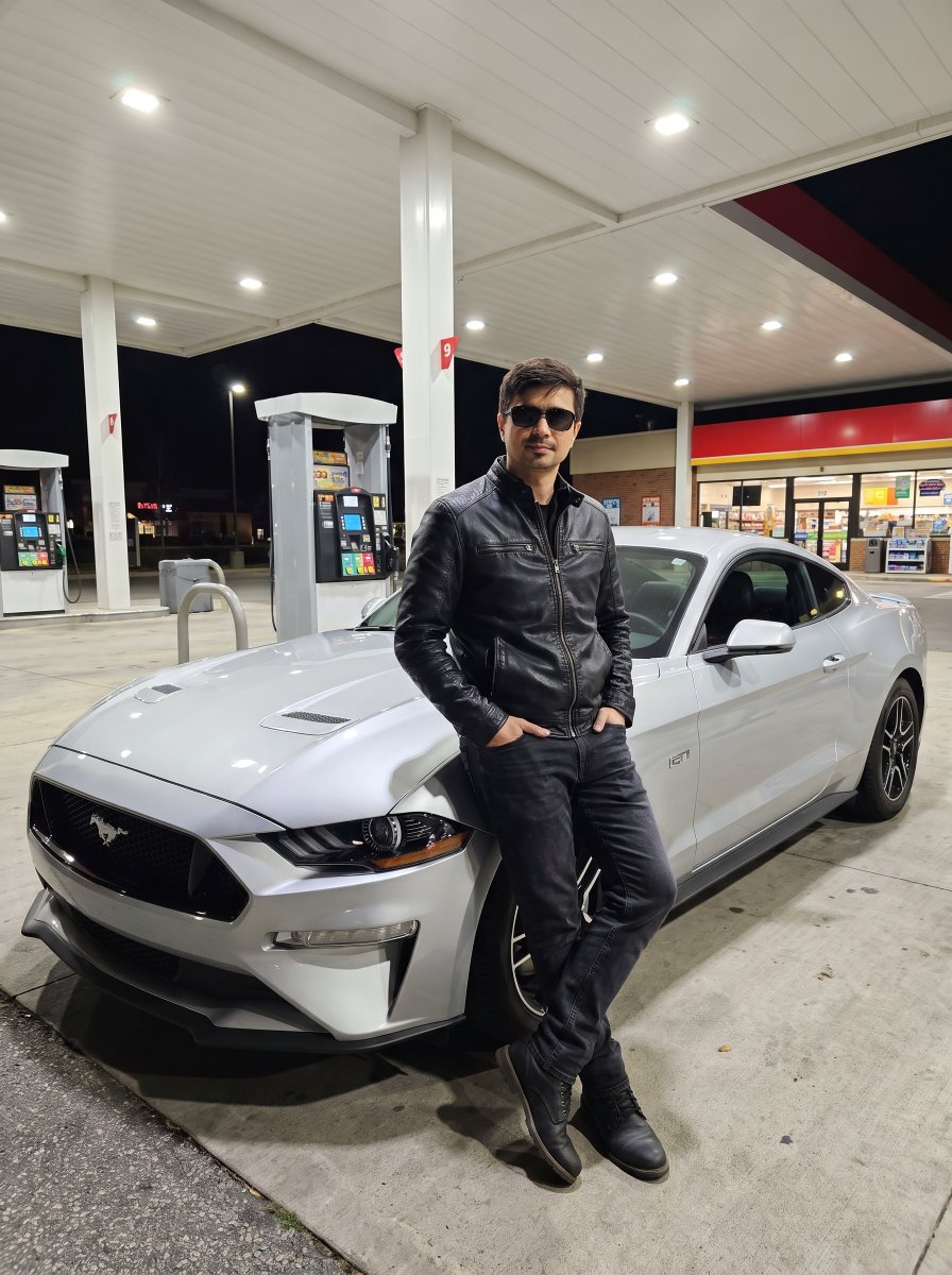 AlexPromptsAI's tweet photo. Even More Sports Cars🏎️

Images created on Nano Banana PRO🍌 Save it for yourself and take cool photos

Upload photo of yourself and add Prompt:👇👇👇

I am standing in front of a gas station at night, next to a modern silver muscle car. My body is facing forward, with a relaxed but confident posture. Both of my hands are casually placed inside the pockets of my jacket. My legs are slightly apart, with one leg bent at the knee and my weight balanced naturally. I am looking directly ahead, wearing dark sunglasses that cover my eyes, which adds a mysterious and stylish vibe. I am dressed