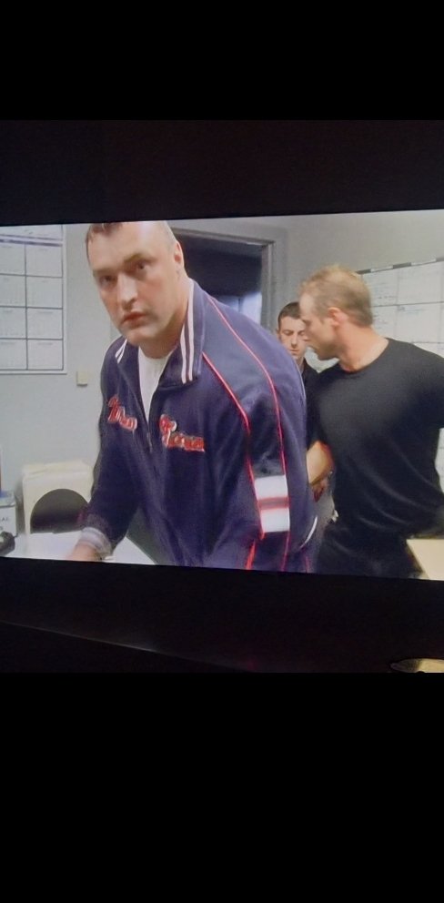 Scoorst's tweet photo. Huge fan of this hired goon in The Wire who charges into a room and looks directly at the camera. https://t.co/zBGOaDc9DT
