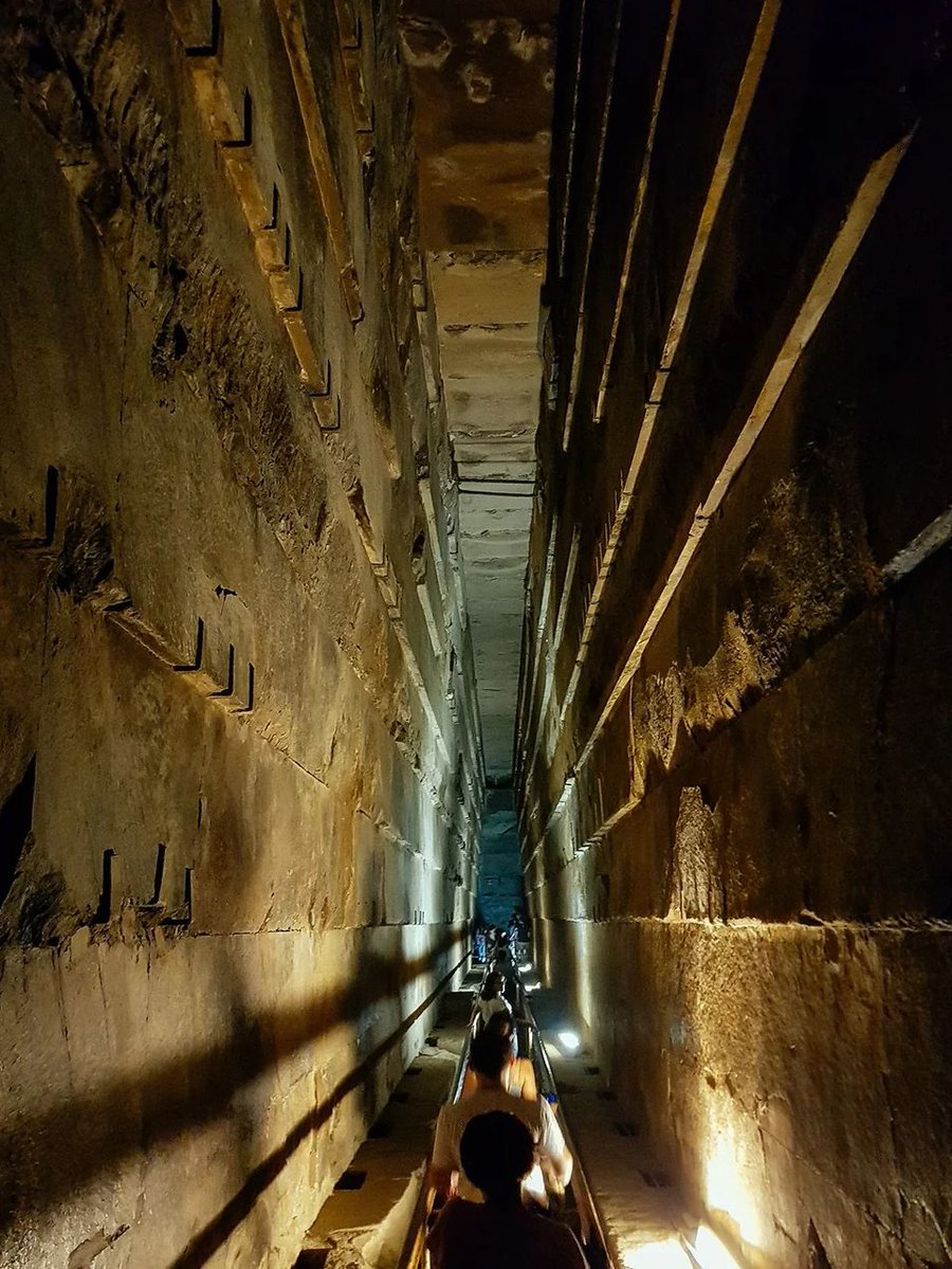 TheProjectUnity's tweet photo. Deep within the Great Pyramid you find the Grand Gallery, then the Antechamber, then you must crawl through a solid megalithic tunnel to enter the Kings Chamber. 

Does it feel like a tomb?  

No, it feels like walking through a megalithic starship from the movie Prometheus. https://t.co/DIguB8YlDU