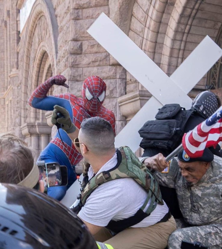 YourAnonCentral's tweet photo. Spiderman vs MAGA in Minneapolis. https://t.co/dl4nfsU989