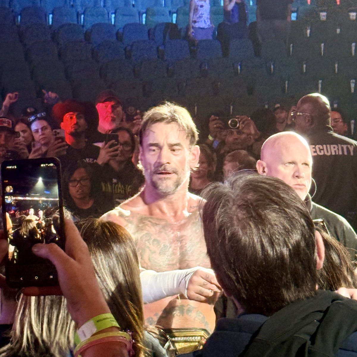 gogglesdonuting's tweet photo. Guys, check in on me. This man’s about to take my lunch money. 😳🤣 #wwe #scotiabanksaddledome #wwesummertour2026 #wwelive #cmpunk https://t.co/WVNXl1cshc