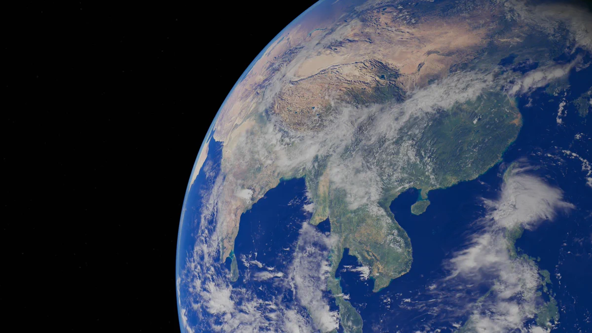 A satellite view of Earth from space, showing the Asian continent, the Himalayas, and the surrounding oceans.
