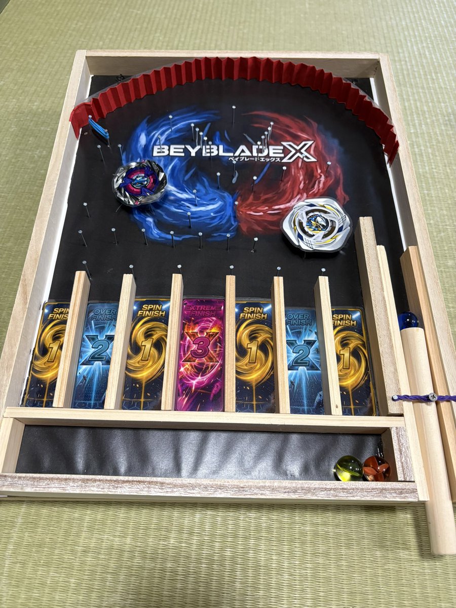 Natsuki821224's tweet photo. 明日から息子は学校スタート！
夏休みの工作で"ビー玉転がしがいい！"ということで、大好きなベイブレードをベースに頑張りました！(はて誰が？ww)
切ったり釘打ちしたりと黙々とやってました！
#ベイブレードX    #夏休みの工作 https://t.co/piSicXq5rI