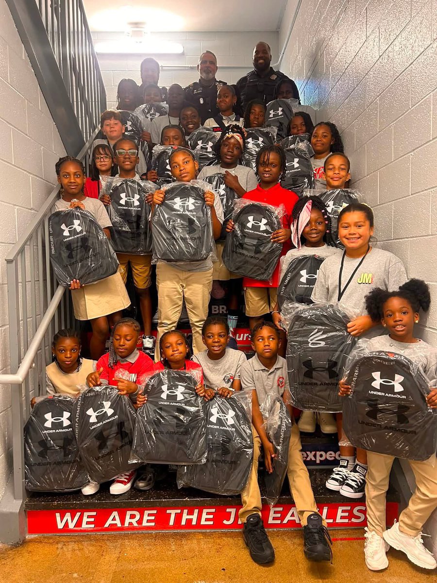 BaltimorePolice's tweet photo. Today, our Southern District NCO team brought smiles & encouragement to the students of James McHenry Elementary/Middle School by providing them with book bags for the new school year. We are proud to support these students as they begin a year filled with learning, growth, and new opportunities. #baltimore