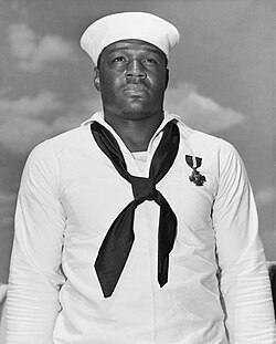 rockitboy911's tweet photo. HOW SLIMY PART 2:: There is a new aircraft carrier being built  which will bear his name The Doris Miller who is Black. Breaking News Trump ordered that the Navy name  the ship after himself  the Coward Trump. He  avoided the Draft and  none of his Family ever served our country. https://t.co/m8KXC8fVt1