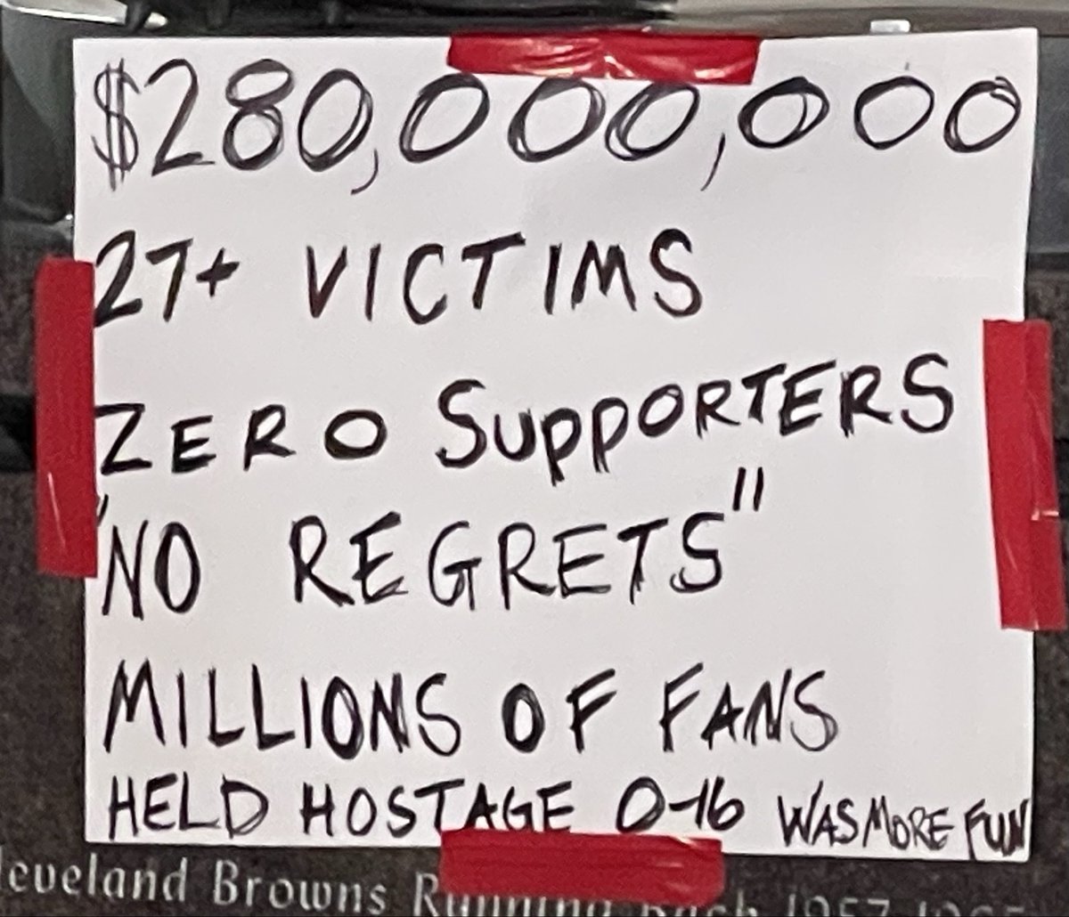 DStamness's tweet photo. An angry Cleveland Browns Fan taped signs of protest on the Jim Brown statue in front of Browns Stadium. https://t.co/dG7LzvAU0Q