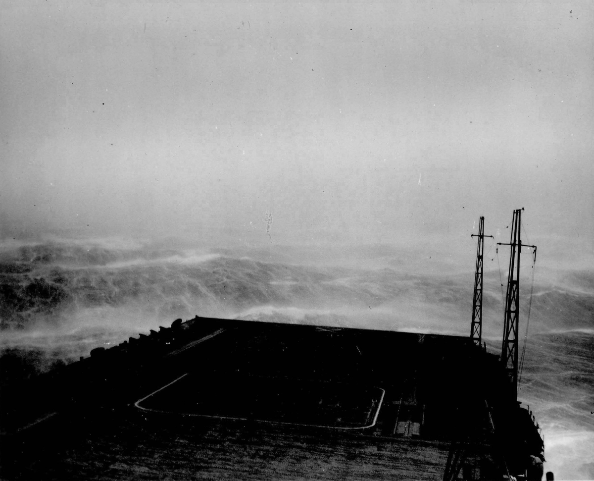 HiddenHistoryYT's tweet photo. USS Wasp (Essex-class) in heavy sea as the ship steamed into a typhoon south of Japan, 25 August 1945. https://t.co/UI7Pv0g2FZ